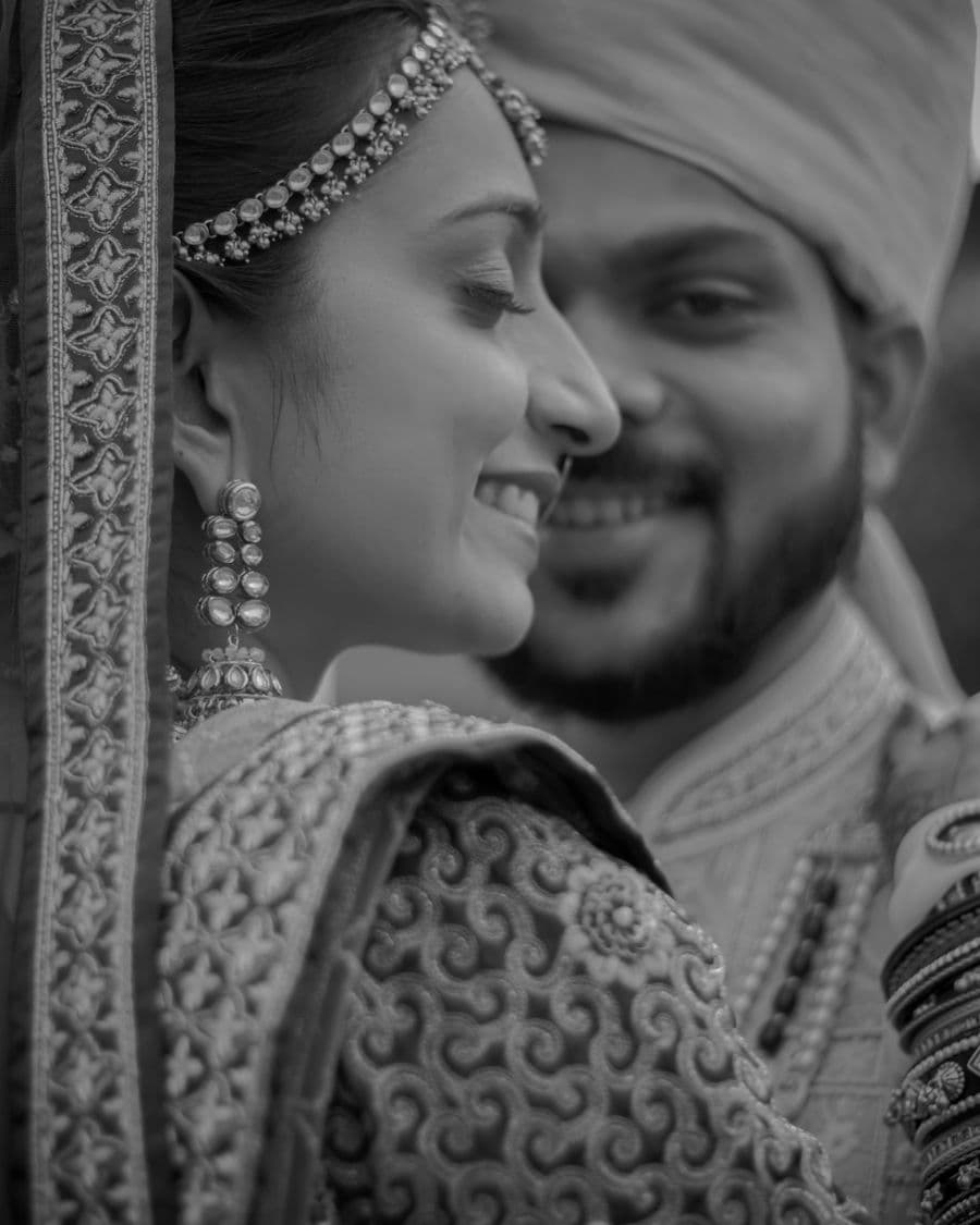 Black and white portrait of a couple in traditional outfits